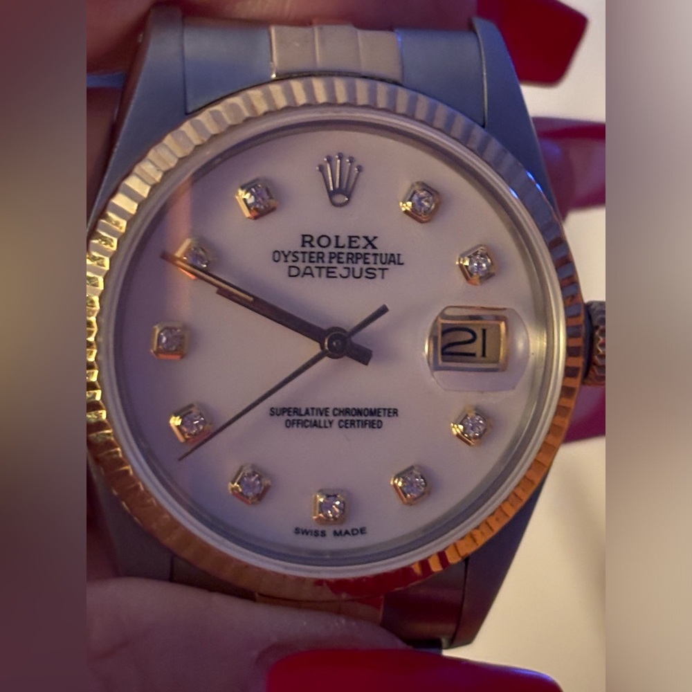 Rolex Datejust 36mm steel & 14k gold jubilee band; pearl face & diamonds.